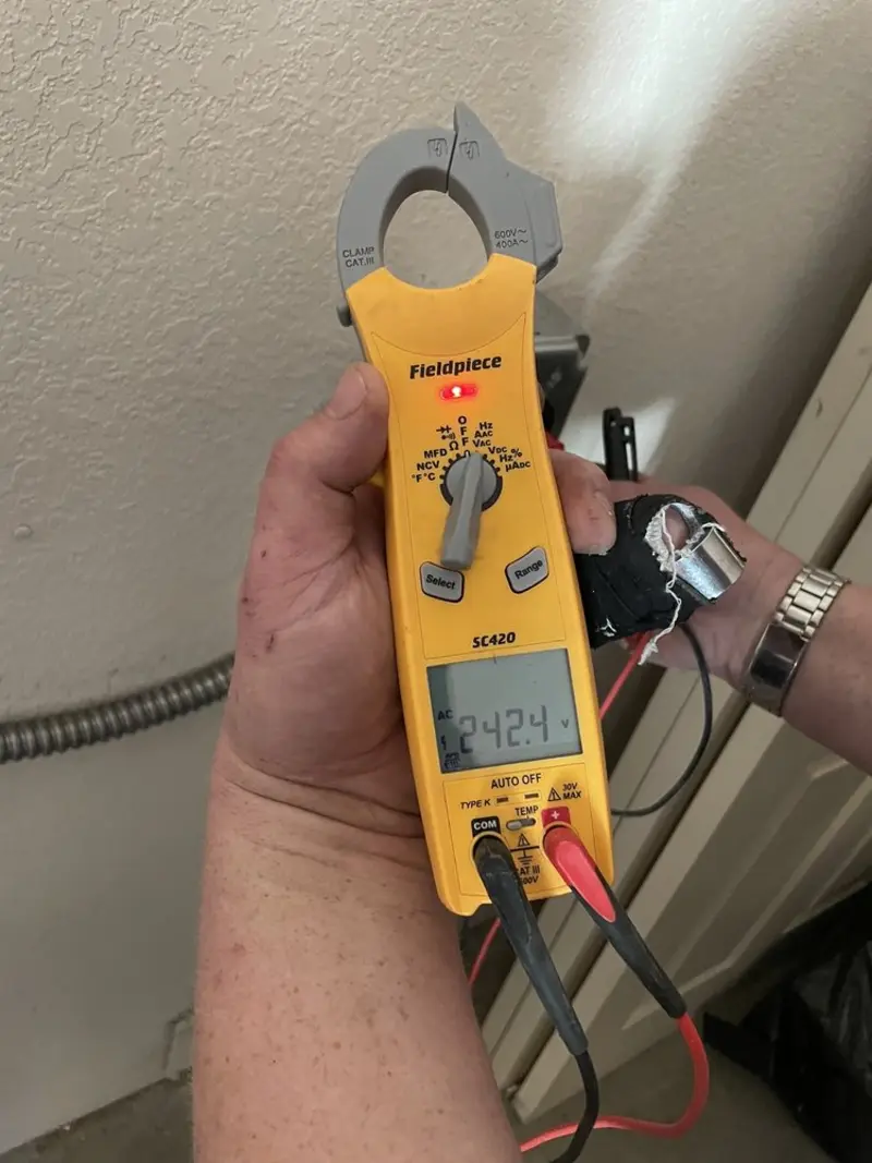 Voltage testing with clamp meter during Electrical Installation Services in Lunenburg